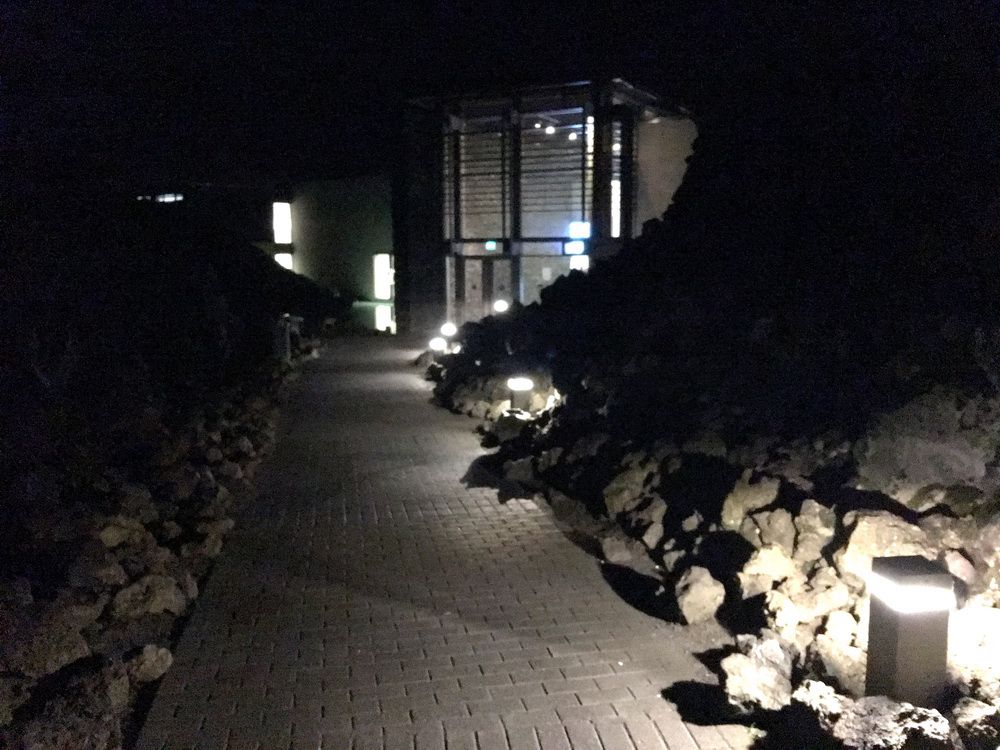 In darkness, the Blue Lagoon is much more like a drab Grey Lagoon. But, just walking down the main entryway to the spa, you can feel it calling you in to visit during cool daylight hours and to enjoy its relaxing and therapeutic properties!