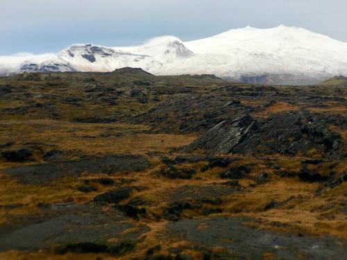 Lava field with the famous Snæfellsjökull volcano (1446m) in the distance.
